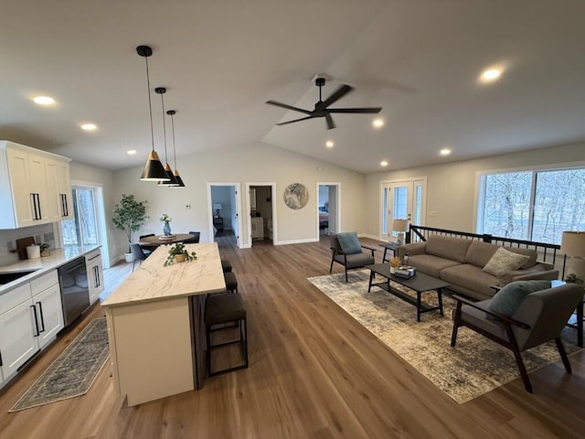 365 13th Dr, Nekoosa, WI 54457 - living area featuring a ceiling fan, lofted ceiling, dark wood finished floors, recessed lighting, and baseboards