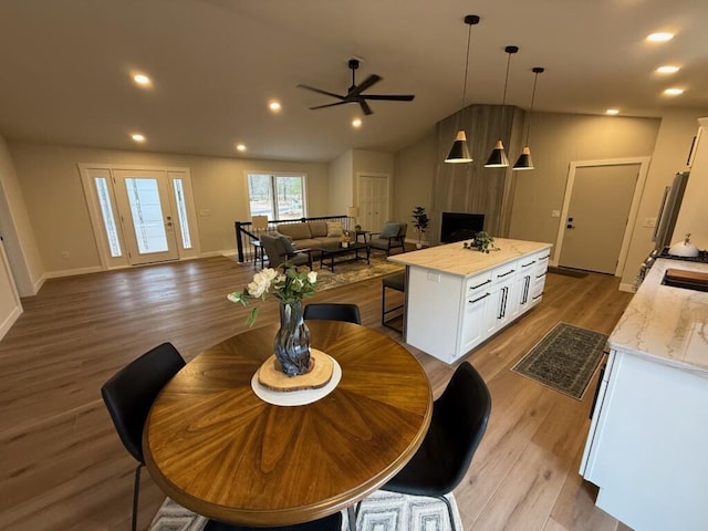365 13th Dr, Nekoosa, WI 54457 - dining area featuring ceiling fan, light wood-style floors, recessed lighting, and baseboards