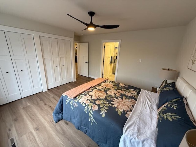 365 13th Dr, Nekoosa, WI 54457 - bedroom featuring two closets, wood finished floors, and a ceiling fan