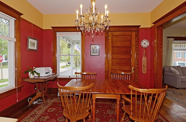 301 Van Buren St, Sauk City, WI 53583 - dining room featuring a notable chandelier, a healthy amount of sunlight, and wood finished floors
