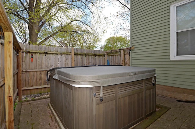 301 Van Buren St, Sauk City, WI 53583 - exterior space featuring a hot tub, fence, and a patio area