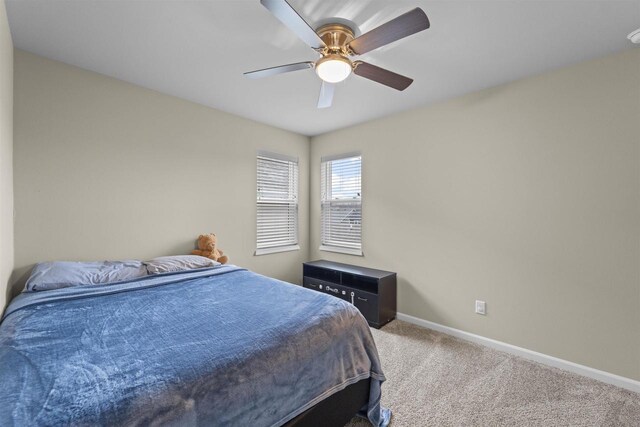5872 Tranquility Trl, Madison, WI 53718 - bedroom with baseboards, a ceiling fan, and carpet flooring