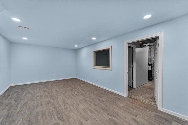 5872 Tranquility Trl, Madison, WI 53718 - spare room with baseboards, wood finished floors, visible vents, and recessed lighting