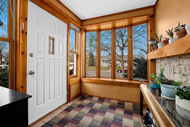 sunroom featuring tile patterned flooring