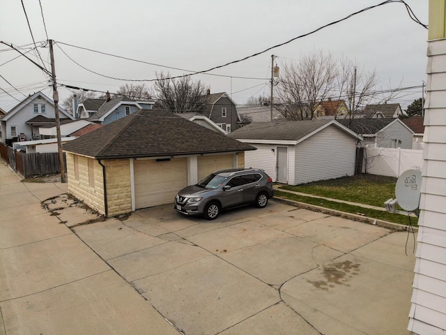 exterior space with fence and a residential view