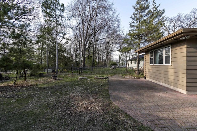 view of yard featuring a patio and fence
