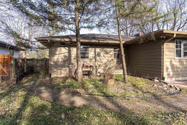 back of property featuring fence