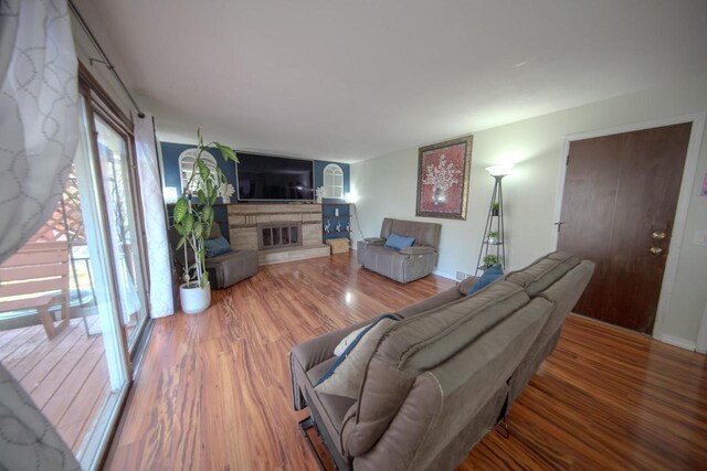 2607 King James Way, Fitchburg, WI 53719 - living area with a stone fireplace and wood finished floors
