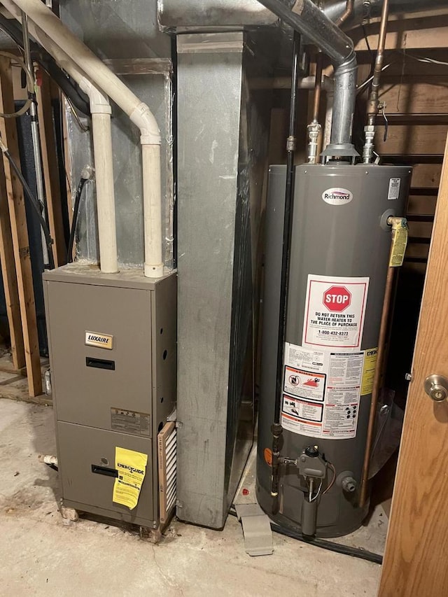 utility room with gas water heater