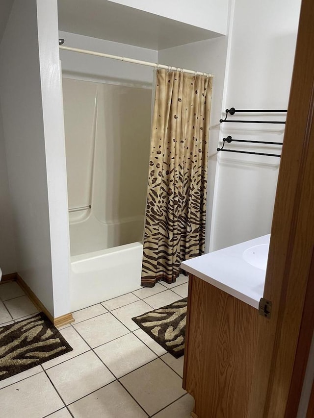 full bathroom featuring vanity, tile patterned flooring, and shower / bath combo