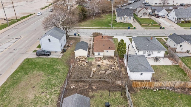 birds eye view of property with a residential view