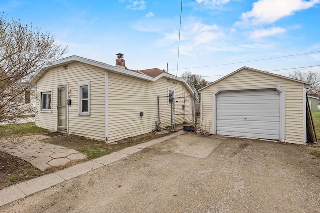 detached garage featuring driveway