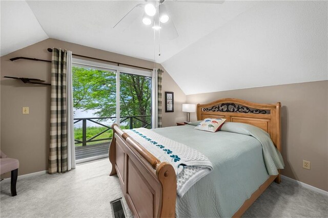 6756 Deer Track Rd, Siren, WI 54872 - bedroom featuring access to exterior, vaulted ceiling, baseboards, light colored carpet, and ceiling fan