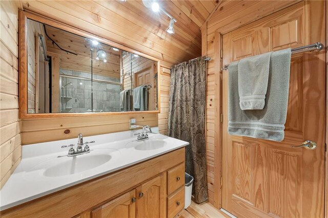 6756 Deer Track Rd, Siren, WI 54872 - bathroom with a sink, wooden walls, and double vanity