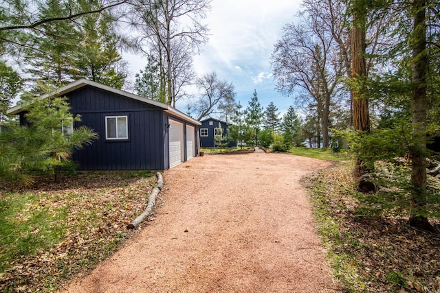 exterior space with an outdoor structure and a garage