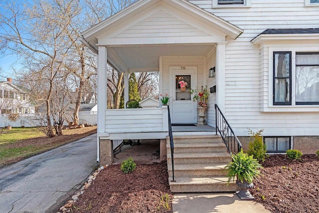 doorway to property with a porch
