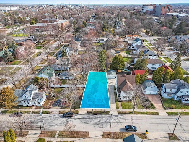 birds eye view of property with a residential view