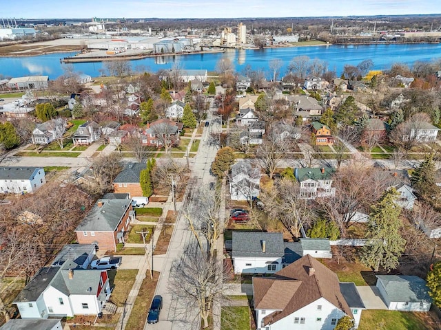 drone / aerial view featuring a water view and a residential view