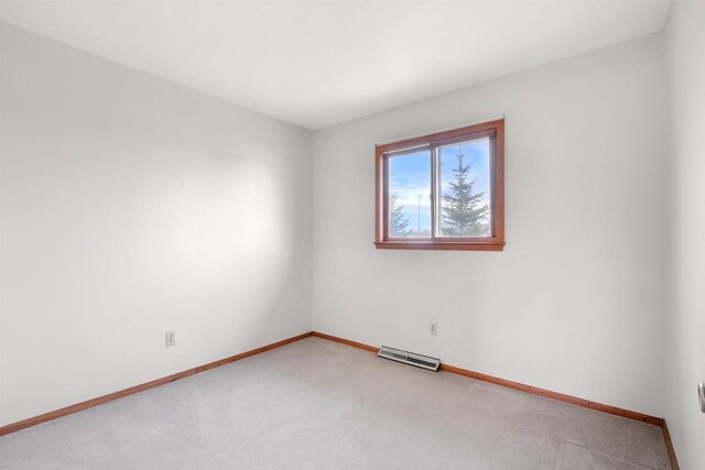 W14390 State Road 23-49, Ripon, WI 54971 - spare room featuring light carpet, visible vents, and baseboards