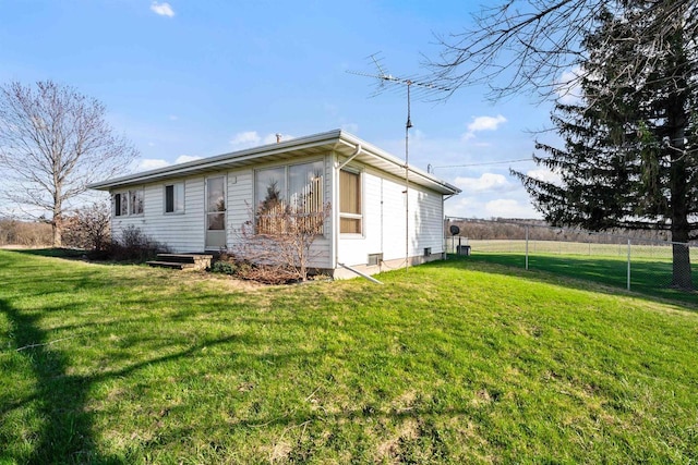 W14390 State Road 23-49, Ripon, WI 54971 - view of side of home with a lawn and fence