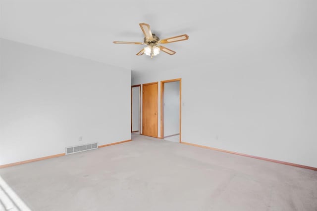 W14390 State Road 23-49, Ripon, WI 54971 - unfurnished room featuring light colored carpet, baseboards, a ceiling fan, and visible vents