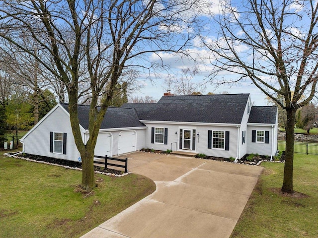 1620 E Murdock Ave, Oshkosh, WI 54901 - new england style home featuring a front lawn, driveway, a chimney, fence, and an attached garage