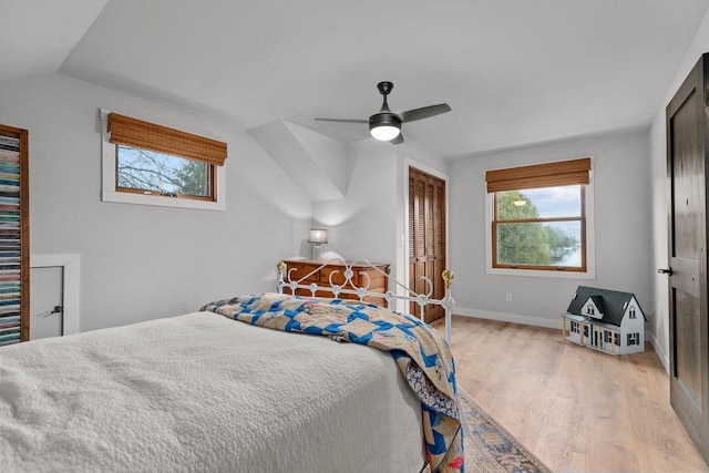 1620 E Murdock Ave, Oshkosh, WI 54901 - bedroom with wood finished floors, a closet, baseboards, and multiple windows