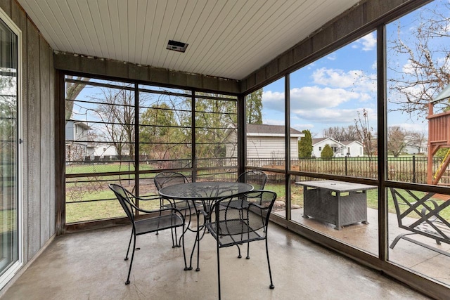 1620 E Murdock Ave, Oshkosh, WI 54901 - sunroom / solarium with a healthy amount of sunlight and outdoor dining area
