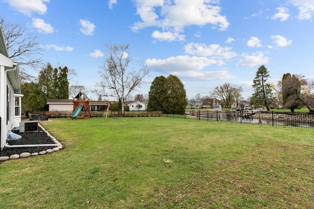 1620 E Murdock Ave, Oshkosh, WI 54901 - view of yard with a fenced backyard, a water view, and a playground