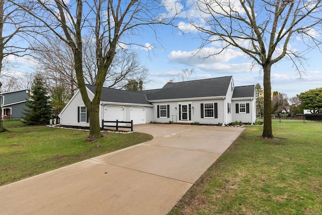 1620 E Murdock Ave, Oshkosh, WI 54901 - cape cod-style house featuring fence, concrete driveway, a front lawn, and a garage