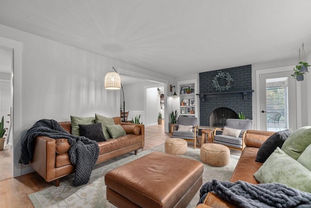 1620 E Murdock Ave, Oshkosh, WI 54901 - living area featuring wood finished floors, a fireplace, and built in shelves