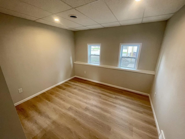 258 Ripon Rd, Berlin, WI 54923 - empty room featuring wood finished floors, a paneled ceiling, baseboards, and visible vents