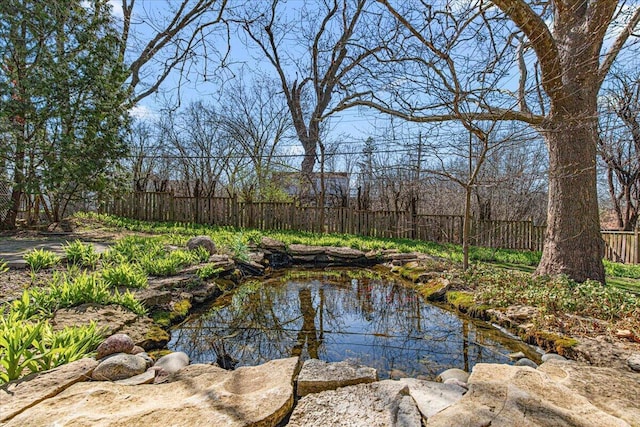 property view of water with fence
