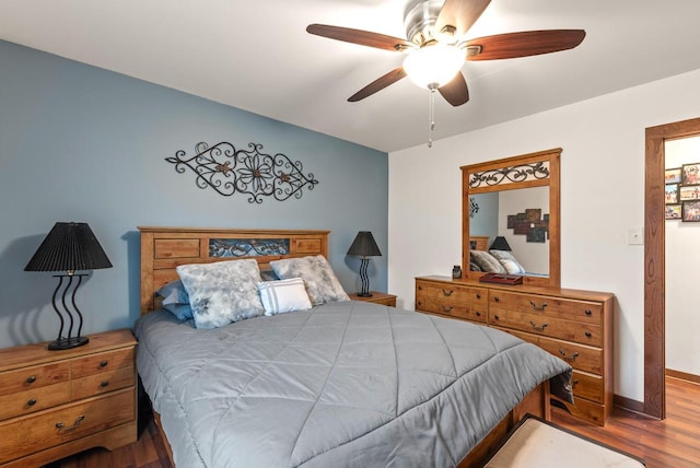 12759 N Shoreland Pkwy, Mequon, WI 53092 - bedroom featuring wood finished floors, ceiling fan, and baseboards