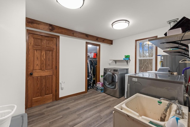 12759 N Shoreland Pkwy, Mequon, WI 53092 - laundry room with independent washer and dryer and wood finished floors