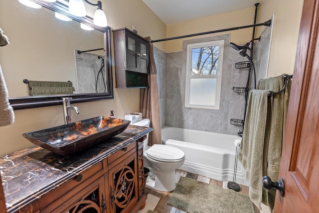 12759 N Shoreland Pkwy, Mequon, WI 53092 - bathroom with shower / tub combo, toilet, vanity, and wood finished floors