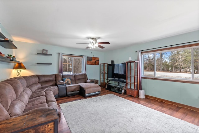 12759 N Shoreland Pkwy, Mequon, WI 53092 - living area with ceiling fan, wood finished floors, and baseboards