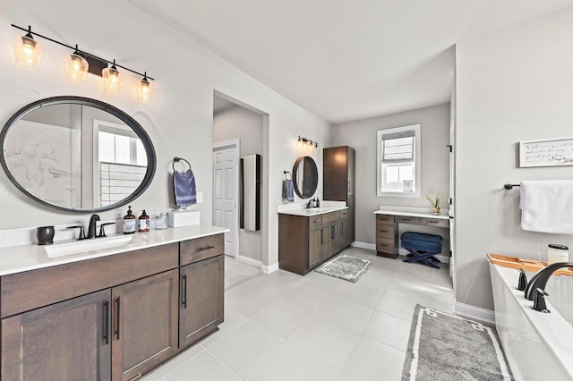 N56W27213 Crispin Ct, Lisbon, WI 53089 - full bath with two vanities, a bathtub, a sink, and baseboards