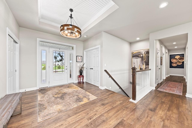 N56W27213 Crispin Ct, Lisbon, WI 53089 - entrance foyer featuring recessed lighting, a raised ceiling, wood-type flooring, baseboards, and a notable chandelier