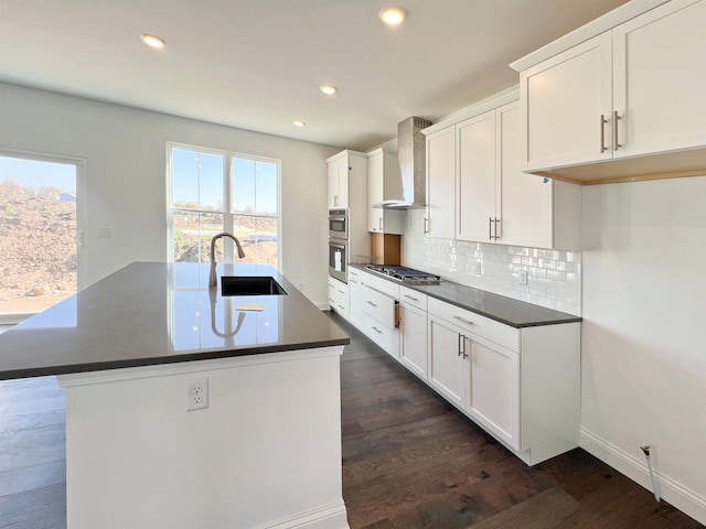 4003 Banbury St, Windsor, WI 53598 - kitchen featuring a sink, wall chimney exhaust hood, stainless steel appliances, dark countertops, and recessed lighting