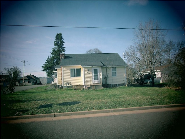 419 Corbett Ave, Ladysmith, WI 54848 - bungalow featuring a front lawn and a chimney