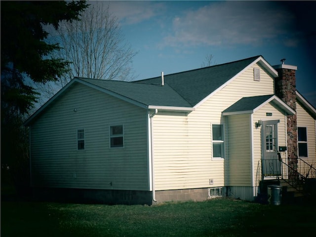 419 Corbett Ave, Ladysmith, WI 54848 - rear view of property with roof with shingles and a yard