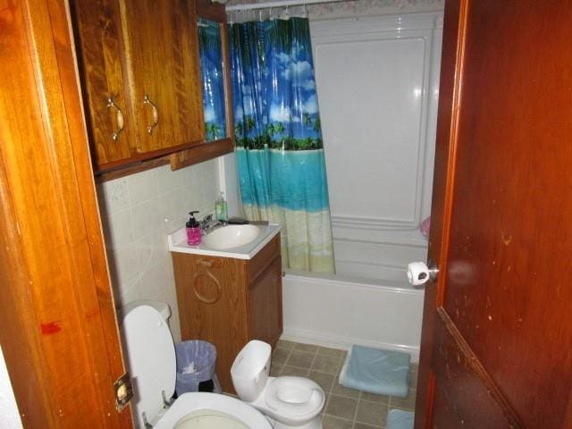 419 Corbett Ave, Ladysmith, WI 54848 - bathroom with vanity, tile patterned flooring, toilet, and shower / tub combo