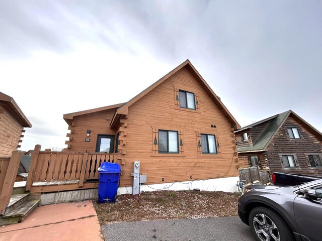 319 Hilltop Ct, Warrens, Warrens, WI 54666 - exterior space with log siding