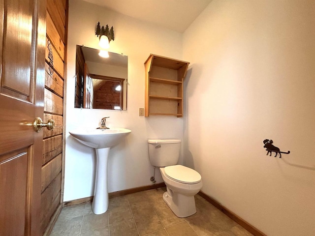 319 Hilltop Ct, Warrens, Warrens, WI 54666 - half bath featuring toilet, tile patterned flooring, and baseboards