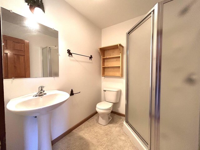 319 Hilltop Ct, Warrens, Warrens, WI 54666 - full bath with a shower stall, toilet, tile patterned flooring, and baseboards