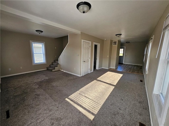 interior space with stairs, baseboards, and carpet