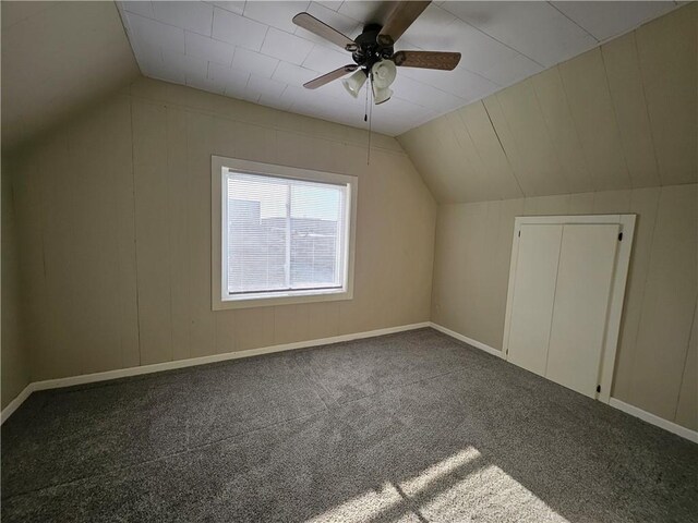 additional living space with carpet floors, a ceiling fan, and vaulted ceiling