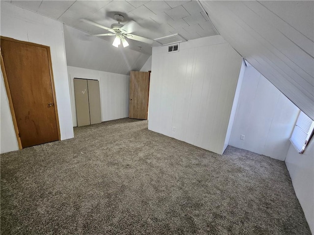 additional living space with carpet flooring, ceiling fan, visible vents, and lofted ceiling