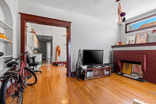 303 N Ashland Ave, Green Bay, WI 54303 - living area featuring wood-type flooring and a fireplace